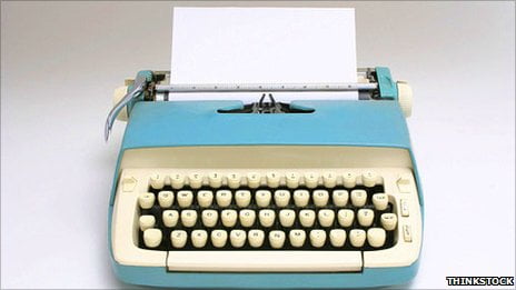 Typewriter with a blank page